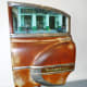 Piece of a car as art in Cuba Behind Open Doors by Kevin Douglas West