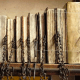 Books were secured to the shelf with a long metal bar going through each chain.