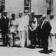 Joseph seen here with distinguished visitors at St. Damien's grave.