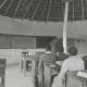 A High School class in session inside one of the rondavels. Teacher at the blackboard is my father, Murray McGregor