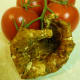 This cup shaped mushroom picked days earlier (in July of 2010) had already hardened and dried. Same campari tomatoes for reference as to size