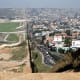 US-Mexican border, Tijuana, Mexico. Tijuana is to the right. Image by Sgt. Hyde, courtesy Wikimedia Commons.