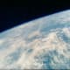 Photo of earth taken from orbit by Gordon Cooper aboard Faith 7. Photo courtesy of NASA.