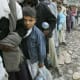 Scores of people standing in queue to get relief material after the earthquake