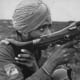 An Indian soldier using an MG42. Note the patch on his forearm, a Tiger over top the Indian national colors (a unit patch of the Indische Legion).