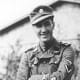 A British member of the Waffen-SS. Note the British flag patch on his wrist.