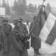 French soldiers of the German "Legion des Voluntaires" unit holding a French flag in Russia, 1941.