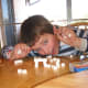 2. Put a sugar cube in between and push the stacks together to hold it.