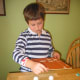 2. Put 4 half-eggshells in a square on a flat surface.