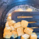 Take out the tofu from the pan after it is browned on both sides.