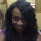 The Anya Curly Wig is Also versatile. Here it is being worn to the side.
