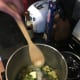 Cooking the vegetables in the margarine.