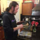Filling the tins with the veggies.