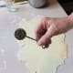 I use the old-fashioned fluted edged pastry cutter.