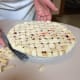 If there are some loose strips of dough left, use the long metal spatula to cut them off.