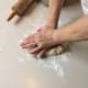 Press the dough again. Now both sides are lightly floured and the dough is 1" thick or less.