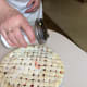 I sprinkle sugar over the top of my pie crusts. You don't have to do this, but I think it adds a bit of browning to the crust.