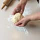 Place ball of dough on a lightly floured surface.