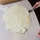 Run a long bladed spatula under the rolled out dough to lift any parts that are sticking to the table.