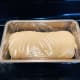 Transfer the dough into the prepared loaf pan. Loosely cover with cling wrap.
