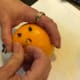 Studding the citrus with the cloves makes it far easier to serve the drink later by ensuring the little cloves don't get lost in the wassail.