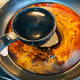 Turn the heat off. Slowly, combine one cup of hot water into the pan.