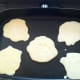 5. Swedish pancakes, cooking busily in the warm skillet. When they get bubbly on top like this, it's probably time to flip them!