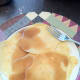 7. Finished Swedish pancakes, topped with extra melted butter for taste and to keep them from sticking together and real dark maple syrup for exquisite flavor.