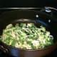 Frying the leeks.