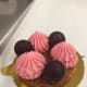 The plum colored pectin spheres and bright pink raspberry mousse pops with color.