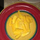 Slice the mangos into small pieces