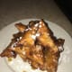 Top with the apricot reduction sauce and confectioner's sugar to serve
