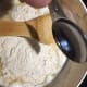 Add flour and almond extract.