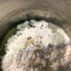Heating oil over medium heat, whisk in flour. This will give the sauce some heft and weight - so it will cling to enchiladas well in the oven.