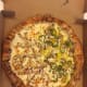 Photo of the pizza in its box.
