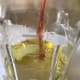Use good olive oil, but it doesn't need to be extra virgin. I pick a good, full bodied olive oil and add red wine vinegar to form the base of the vinaigrette.
