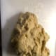 The dough is not sticky, but tacky. You also don't want to add so much flour that it becomes smooth.