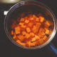 In a large pan, boil the potatoes until soft.