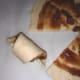 After adding the topping and cutting into wedges, roll up each wedge from wide end to point