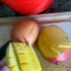 To easily dice mango, slice along the large pit. Score the fruit and turn skin inside out. Remove pieces.