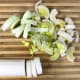 Slice the leeks into 1/4-inch slices. It's important to wash the leeks thoroughly after slicing and not before. When leeks grow, dirt gets caught in between each layer, so they really need to be separated when washed.