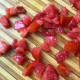 Dice the tomato into medium sized chunks.