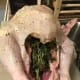 This is what I'm talking about when I say to stuff the cavity with the fresh herbs. I know some people don't like reach their hands into the bird, and that's fine. You can skip this step.