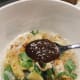 Garnish with chopped cilantro, fried shallots, and sambal kicap.