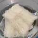 In a large bowl, soak the rice noodles with warm water until soft.
