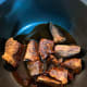 Melt the palm sugar with 2 tablespoons of water over low heat. Set aside.