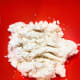In a large bowl, place the grated cassava root.