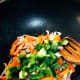 Add the carrots and green bell pepper into the mixture.