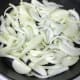 Please don't use a non-stick pan for this if at all possible. It's much better in this instance to use cast iron if you have it, or at least stainless steel. Heat the oil until it's very hot, add the onions, stir, and reduce to low heat.