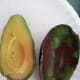 If done carefully, the avocado can be spooned out in one whole piece.